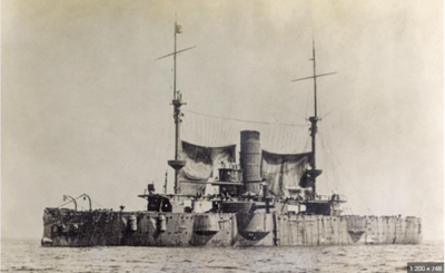 The USS San Marcos rests at anchor in March 1911 just before the initiation of gunnery trials..png